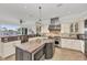 Gourmet kitchen with granite countertops and an island at 550 Yardarm Ln, Longboat Key, FL 34228