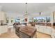 Open concept kitchen with island and living area views at 550 Yardarm Ln, Longboat Key, FL 34228