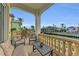 Waterfront patio with seating area and canal views at 550 Yardarm Ln, Longboat Key, FL 34228