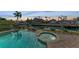 Evening view of the pool and spa at 550 Yardarm Ln, Longboat Key, FL 34228