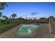 Evening view of the pool and spa at 550 Yardarm Ln, Longboat Key, FL 34228