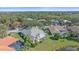 Aerial view of a house with a pool, surrounded by other homes at 5655 Eastwind Dr, Sarasota, FL 34233