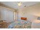 Guest bedroom with a double door closet and dresser at 5655 Eastwind Dr, Sarasota, FL 34233