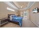 Main bedroom with a wood bed frame and large window at 5655 Eastwind Dr, Sarasota, FL 34233