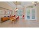 Bright dining room with a wood table and red chairs at 5655 Eastwind Dr, Sarasota, FL 34233