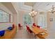 Bright dining room with a wood table and red chairs at 5655 Eastwind Dr, Sarasota, FL 34233