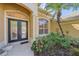 Front entrance with double doors and decorative glass at 5655 Eastwind Dr, Sarasota, FL 34233