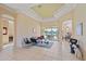 Bright living room with tiled floors, comfy seating, and access to a patio at 5655 Eastwind Dr, Sarasota, FL 34233