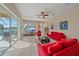 Living room with sliding doors leading to pool area at 5655 Eastwind Dr, Sarasota, FL 34233