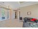 Living room with black leather couch and entryway view at 5655 Eastwind Dr, Sarasota, FL 34233