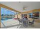 Covered patio with pool and lake view at 5655 Eastwind Dr, Sarasota, FL 34233