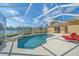 Screened pool and spa overlooking a lake at 5655 Eastwind Dr, Sarasota, FL 34233