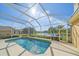 Inviting screened pool with lake view at 5655 Eastwind Dr, Sarasota, FL 34233