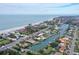 Aerial view of house near beach and waterway at 5830 Gulf Of Mexico Dr, Longboat Key, FL 34228