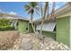 Green house exterior with walkway at 5830 Gulf Of Mexico Dr, Longboat Key, FL 34228