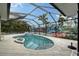 Enclosed pool and spa with tropical-themed walls at 5830 Gulf Of Mexico Dr, Longboat Key, FL 34228