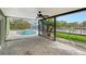 Enclosed patio with pool, spa, and water views at 5830 Gulf Of Mexico Dr, Longboat Key, FL 34228