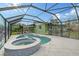 Enclosed pool and spa with tropical-themed walls at 5830 Gulf Of Mexico Dr, Longboat Key, FL 34228