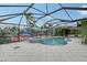 Relaxing kidney-shaped pool with spa and waterfall backdrop at 5830 Gulf Of Mexico Dr, Longboat Key, FL 34228