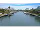 Wide shot of a canal with multiple waterfront homes and private docks at 5830 Gulf Of Mexico Dr, Longboat Key, FL 34228