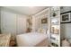 Guest bedroom with a comfortable bed, built-in shelves, and plenty of light at 5890 Guarino Dr, Sarasota, FL 34238