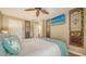 Bright bedroom with a comfy bed, large TV, and decorative wall art at 5890 Guarino Dr, Sarasota, FL 34238