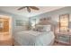 Bright bedroom with a queen bed and ensuite bathroom access at 5890 Guarino Dr, Sarasota, FL 34238