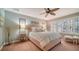 Relaxing bedroom with a comfortable bed, stylish decor, and ample natural light at 5890 Guarino Dr, Sarasota, FL 34238