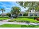 Community clubhouse with landscaping and walkway at 5890 Guarino Dr, Sarasota, FL 34238