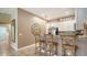 Kitchen boasts a breakfast bar with stylish stools and white cabinetry at 5890 Guarino Dr, Sarasota, FL 34238