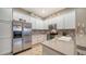 Modern kitchen with stainless steel appliances and ample counter space at 5890 Guarino Dr, Sarasota, FL 34238