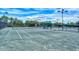 Well-lit tennis courts for residents' enjoyment at 5890 Guarino Dr, Sarasota, FL 34238