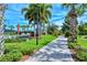 Landscaped walkway leading to community amenities at 5890 Guarino Dr, Sarasota, FL 34238