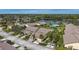 Aerial view of a villa with a two-car garage and a lush lawn at 5911 Doral Dr, Sarasota, FL 34243