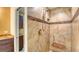 Walk-in shower with tiled walls and built-in seat at 5911 Doral Dr, Sarasota, FL 34243