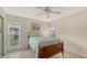 Guest bedroom with a full-size bed and large windows at 5911 Doral Dr, Sarasota, FL 34243