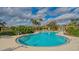 Enjoy this relaxing community pool with plenty of surrounding lounge chairs at 5911 Doral Dr, Sarasota, FL 34243