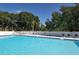 Inviting community pool with lounge chairs at 5911 Doral Dr, Sarasota, FL 34243