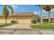 Two-car garage with light beige doors at 5911 Doral Dr, Sarasota, FL 34243