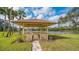 Peaceful gazebo overlooking a scenic lake, perfect for relaxing at 5911 Doral Dr, Sarasota, FL 34243