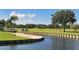 Golf course with sand trap, bridge and golf carts at 5911 Doral Dr, Sarasota, FL 34243