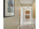 Bright hallway with tile flooring and access to multiple rooms at 5911 Doral Dr, Sarasota, FL 34243