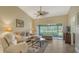 Bright living room with sliding doors to a view at 5911 Doral Dr, Sarasota, FL 34243