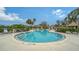 Community pool with surrounding lounge chairs and gazebo at 5911 Doral Dr, Sarasota, FL 34243