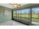 Sunroom with sliding glass doors and view of the community at 5911 Doral Dr, Sarasota, FL 34243