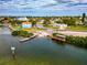 An aerial view with direct water access, docks, and lush greenery at 631 43Rd Street W Blvd, Palmetto, FL 34221