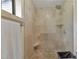 Large walk-in shower with beige tile and built-in seat at 631 43Rd Street W Blvd, Palmetto, FL 34221