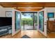 Cozy living room showcasing the outdoor deck and views through glass doors at 631 43Rd Street W Blvd, Palmetto, FL 34221