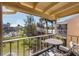 Screened balcony with table and chairs, offering a view of the community at 6360 7Th W Ave # 6360, Bradenton, FL 34209