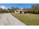 Gravel driveway leading to a charming ranch house at 6424 18Th E Ave, Bradenton, FL 34208